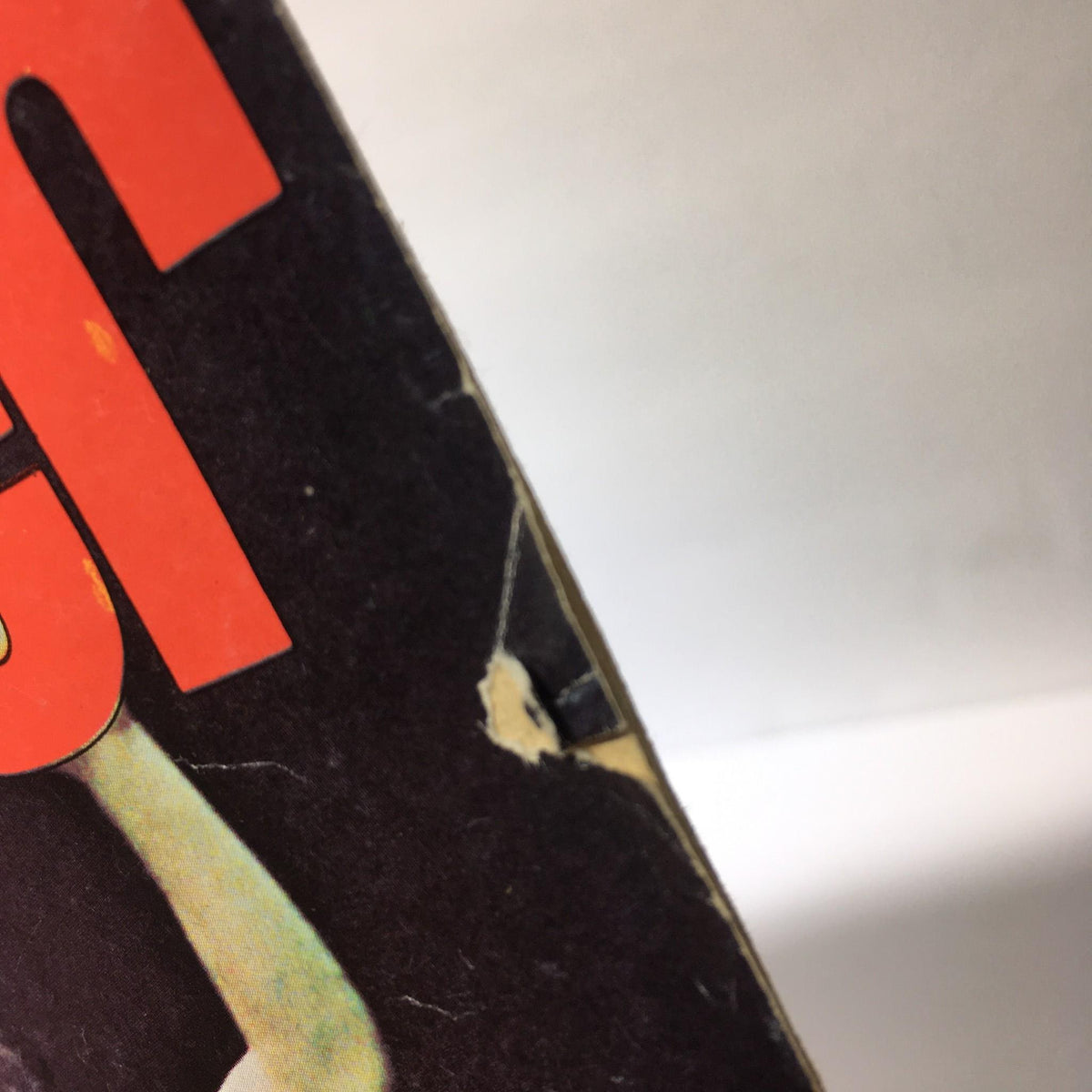 Side view of The Wrestler Magazine October 1976, showing slight wear and tear, indicative of its vintage status as a collectible item.