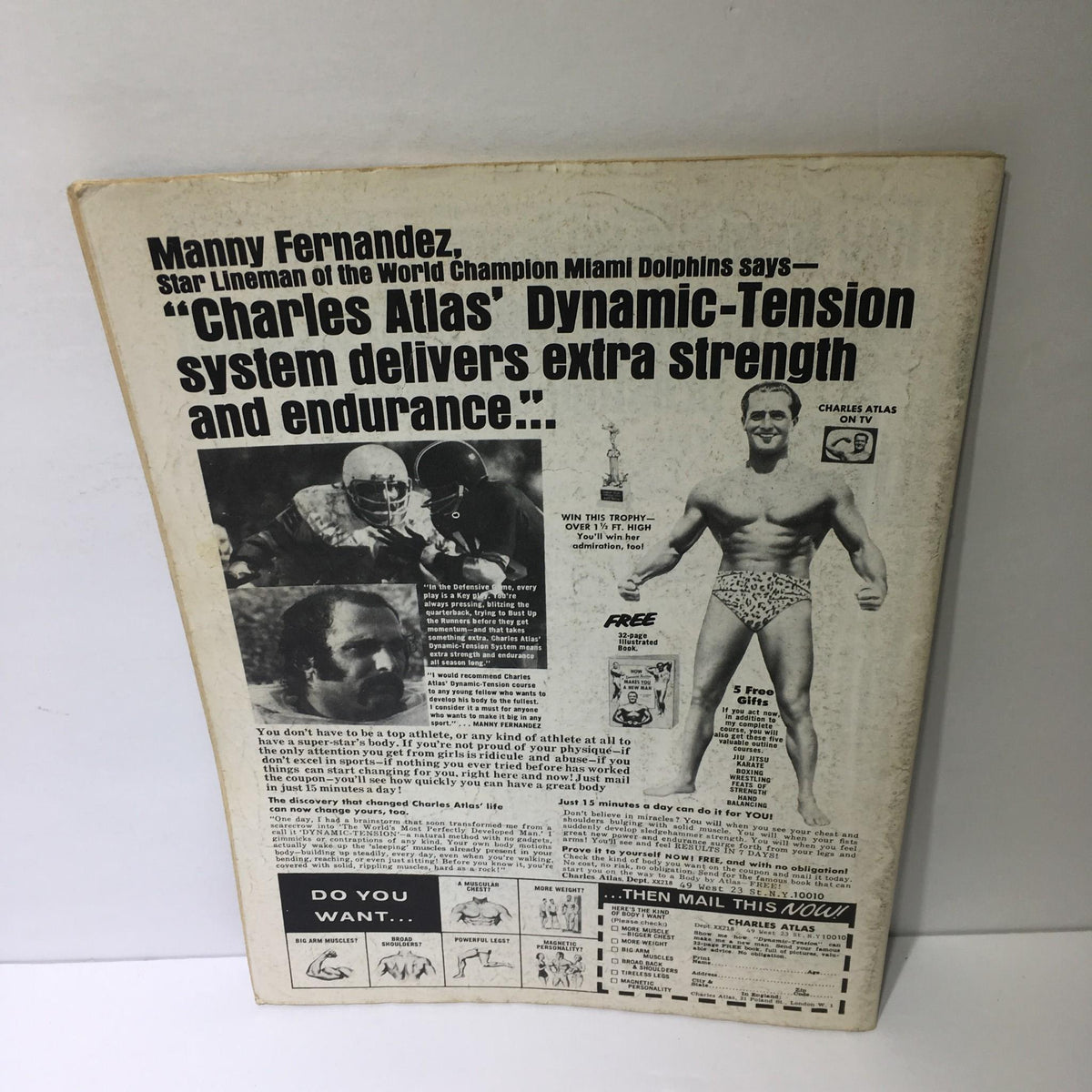 Back view of The Wrestler Magazine October 1976, featuring a promotional ad for Charles Atlas and showcasing the magazine's historical context.