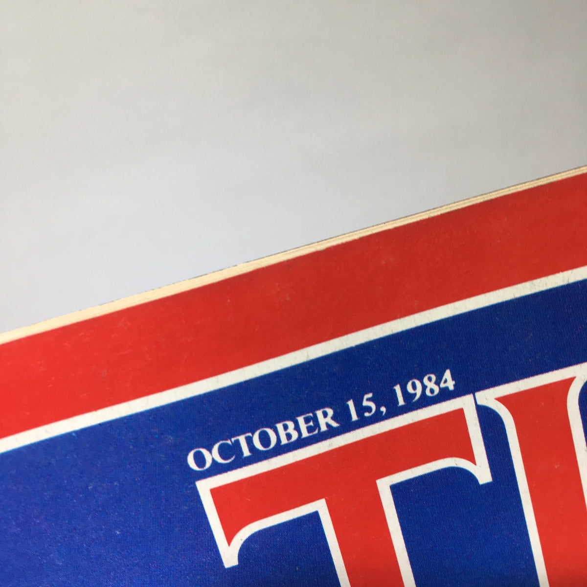 Close-up view of the top corner of the Time Magazine cover dated October 15, 1984, displaying the publication date.