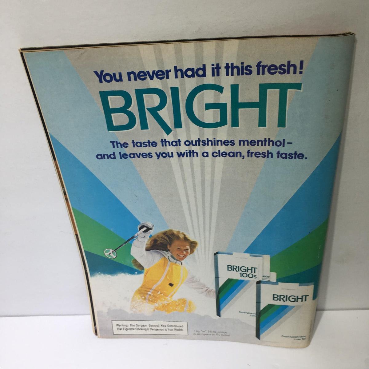 Advertisement on the back of the Time Magazine December 12 1983 for 'Bright' cigarettes featuring a child playing in the snow.
