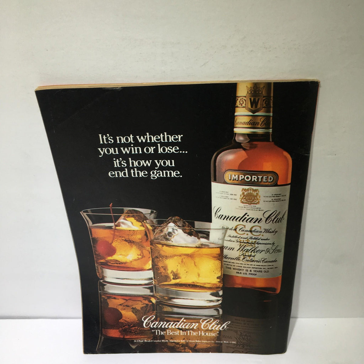 Advertisement for Canadian Club whiskey from a vintage Time Magazine Oct 31 1983 issue, featuring a tagline about winning and losing.