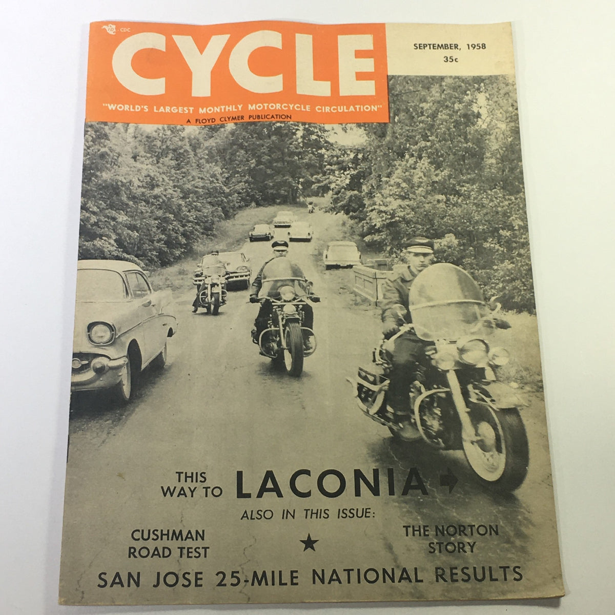 Cover of VTG Cycle Magazine September 1958 featuring a scenic motorcycle ride with vintage cars, highlighting Cushman Road Test and The Norton Story.