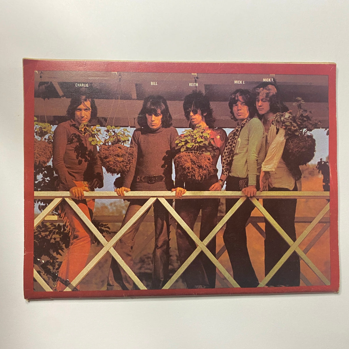 The Rolling Stones group photo from Super Stars Magazine Vol 1 No 2, featuring members Charlie, Bill, Keith, Mick J., and Mick T. posing with potted plants.