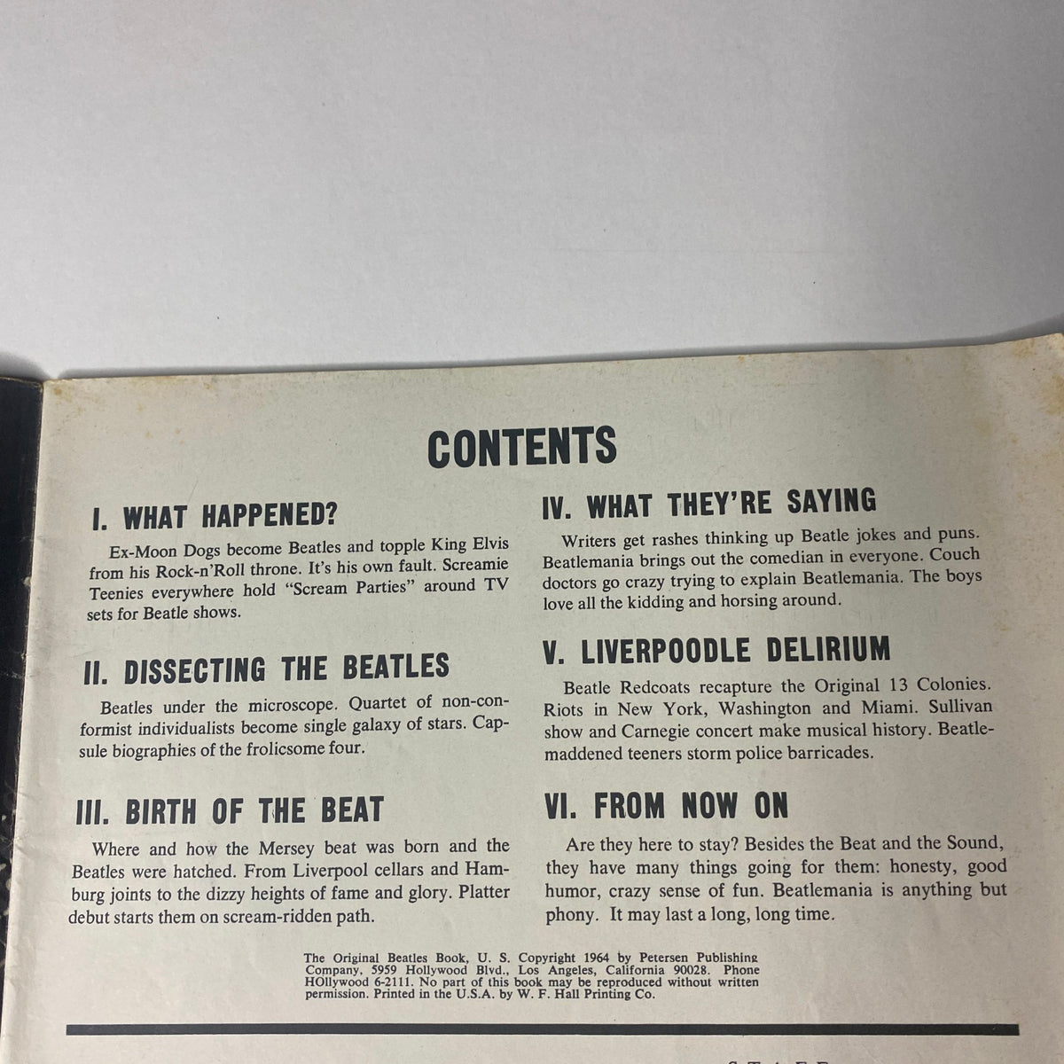 Table of contents from '1964 The Original Beatles Book', listing articles including 'What Happened?', 'Dissecting the Beatles', and 'Liverpoodle Delirium', highlighting the magazine's focus on the Fab Four.