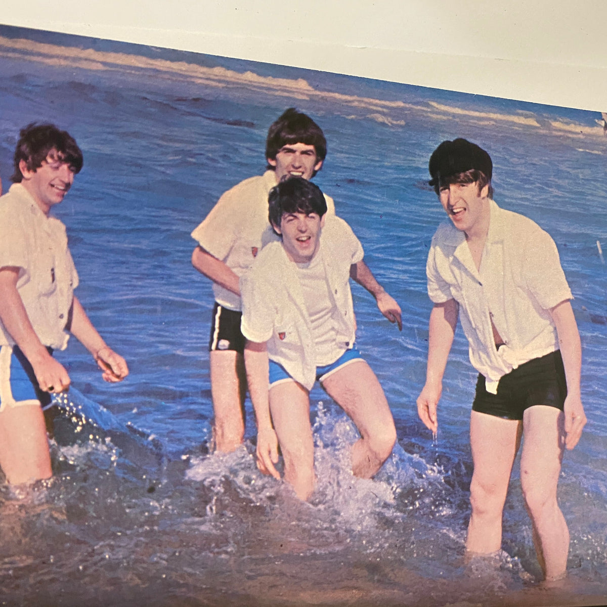 Image from 'Welcome Back The Beatles Part II' depicting the Beatles playing in the ocean, captured in a playful moment.