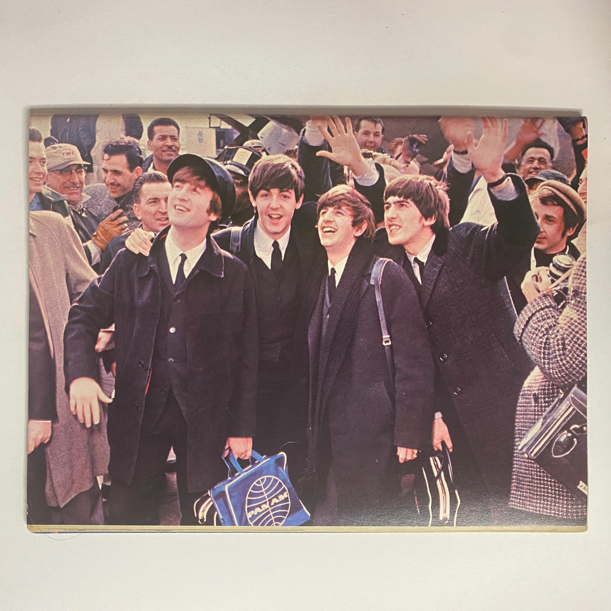 1977 Welcome Back The Beatles Part II No Label VG - A classic photograph from the 1960s showing The Beatles, smiling and waving to fans, capturing the band's charismatic presence and influence on music culture.