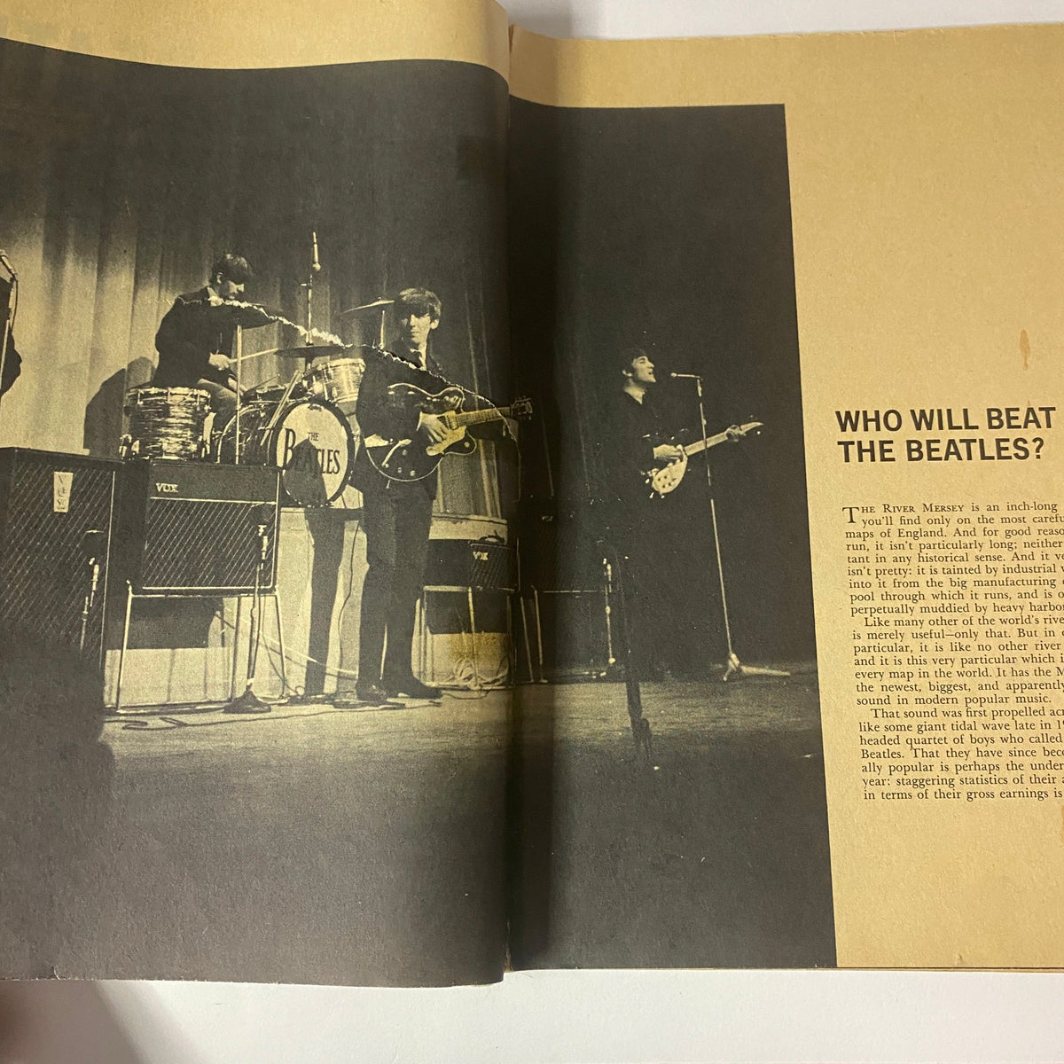 Historic photo of The Beatles performing live in a magazine spread from 'Who Will Beat The Beatles? The Mersey Sound Hits America'.