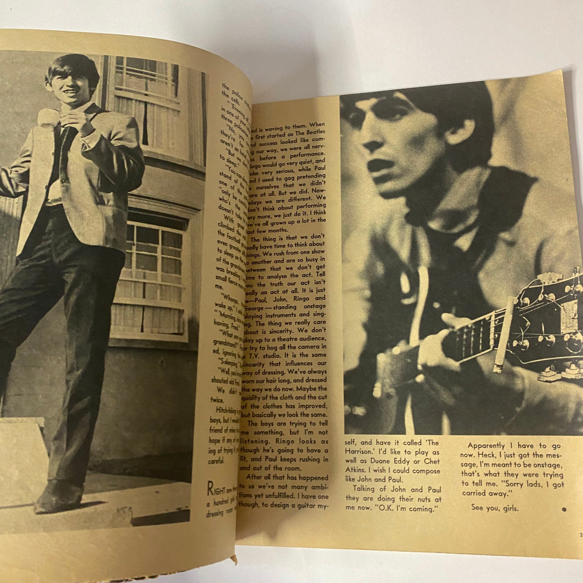 Interior image from 1964 All About The Beatles No. 1 magazine, featuring George Harrison in a stylish suit, showcasing a candid moment.