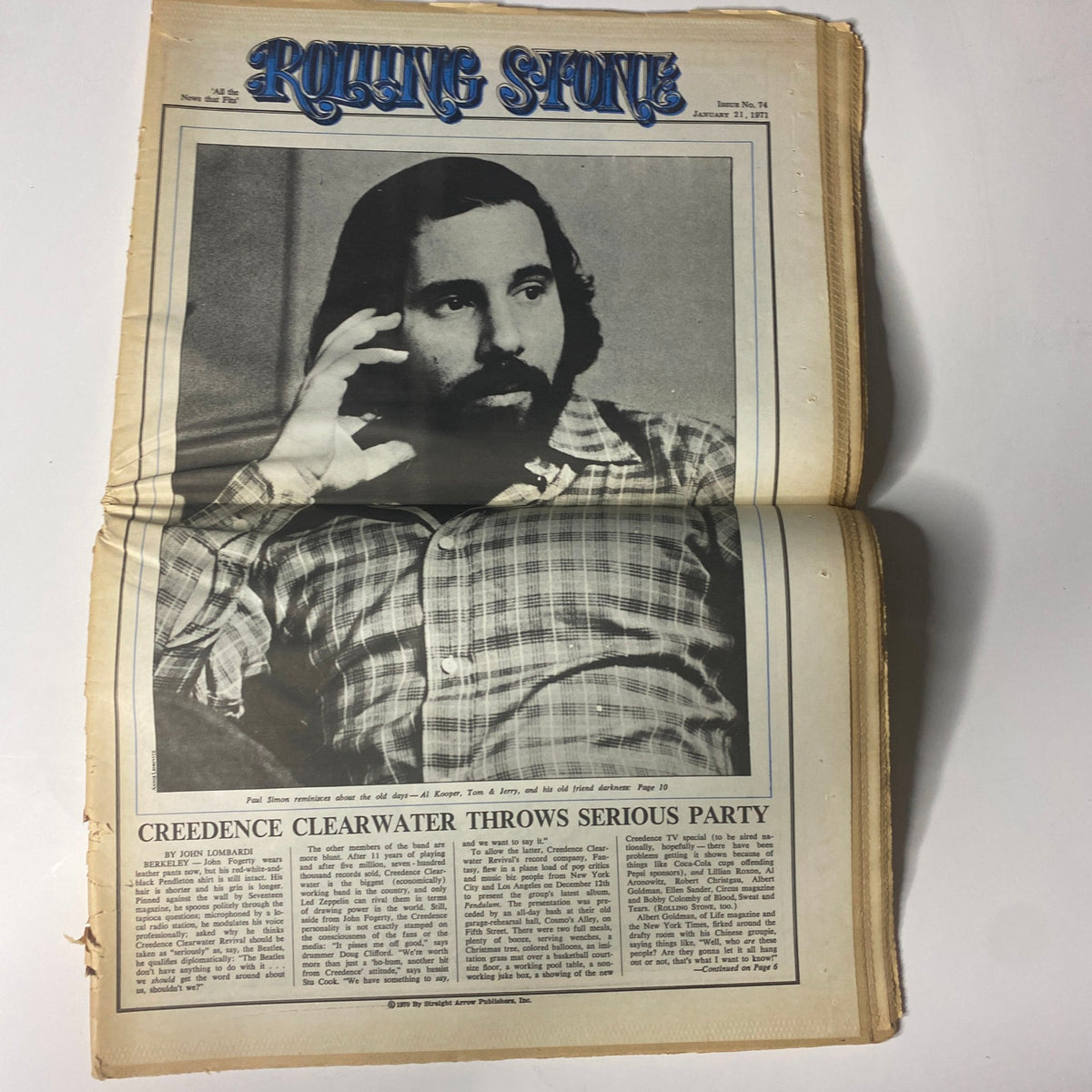 Inside of Rolling Stone Magazine January 21, 1971 featuring a profile of Paul Simon with article titled 'Creedence Clearwater Throws Serious Party'.