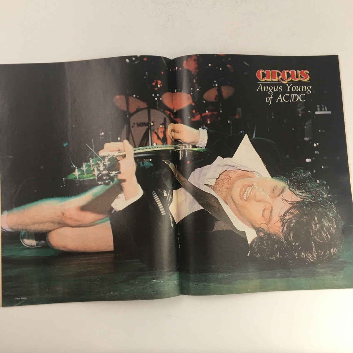 Inside spread of Circus Magazine January 16, 1979 showcasing Angus Young of AC/DC in a dynamic performance pose.