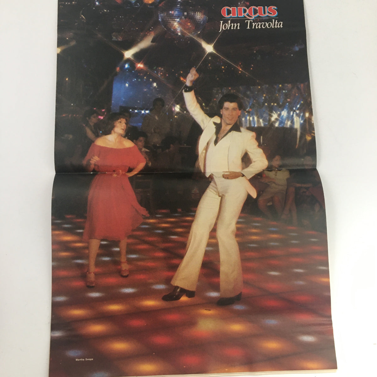 Double fold-out poster of John Travolta from Circus Magazine May 11, 1978 capturing the iconic dance scene reflective of the disco era.