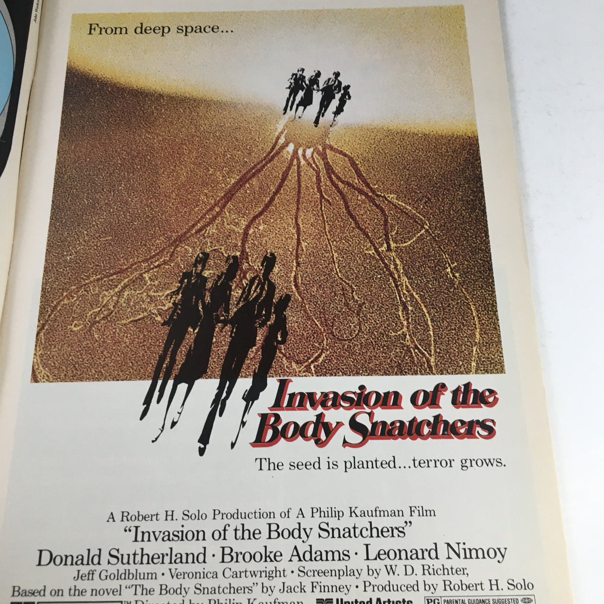 Cover illustration from Heavy Metal Magazine January 1979 featuring a movie ad for 'Invasion of the Body Snatchers' with distinct shadows and text about the film.
