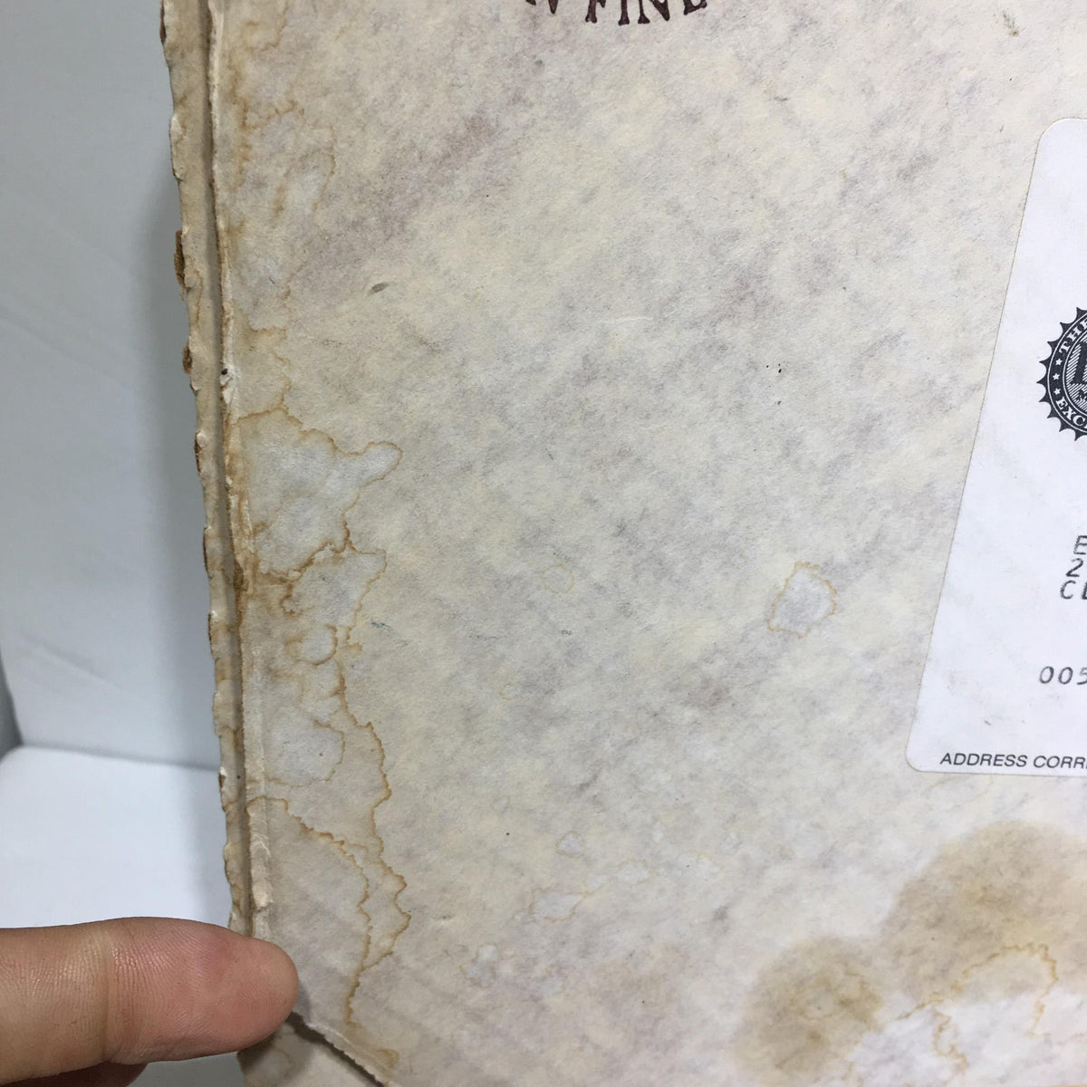 Side view of the original box for the 1985 A Couple's Commitment by Norman Rockwell Collectible Plate #12448I, highlighting its aged appearance.
