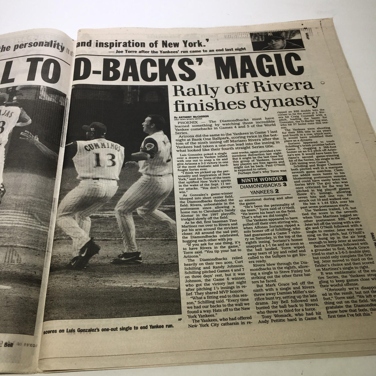 NY Daily News 11/5/01: Close-up action shot of a play during the game, accompanying the article 'End of An Era: Yanks Incredible Series Run Dies in Desert'.