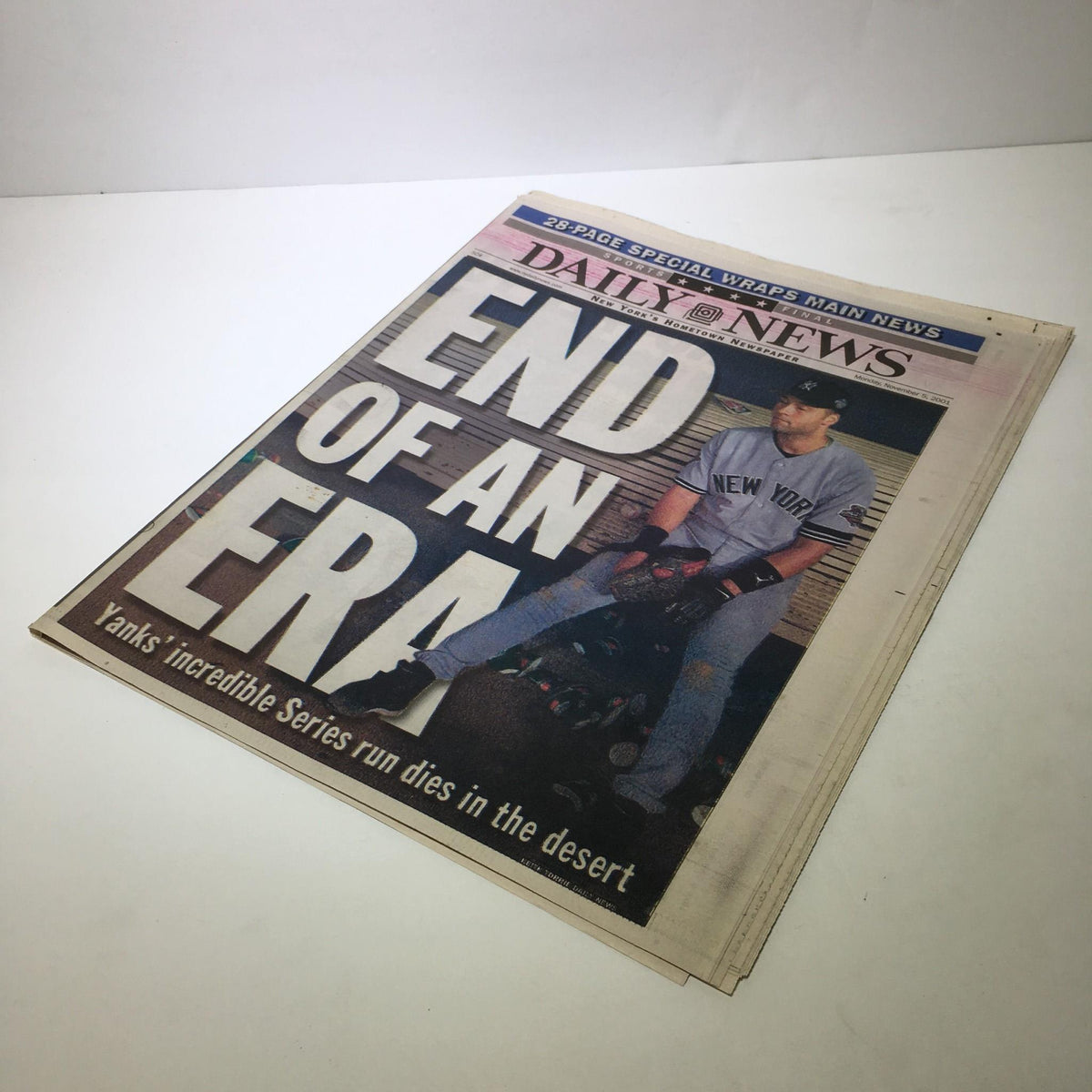 NY Daily News 11/5/01: Cover image showing Yankees player in despair, reflecting on the sentiments from the article 'End of An Era: Yanks Incredible Series Run Dies in Desert'.