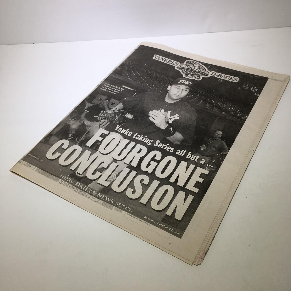Front page of NY Daily News, October 27, 2001, featuring the headline 'Yanks Taking Series All But A FourGone Conclusion' with a visual of a New York Yankees player.