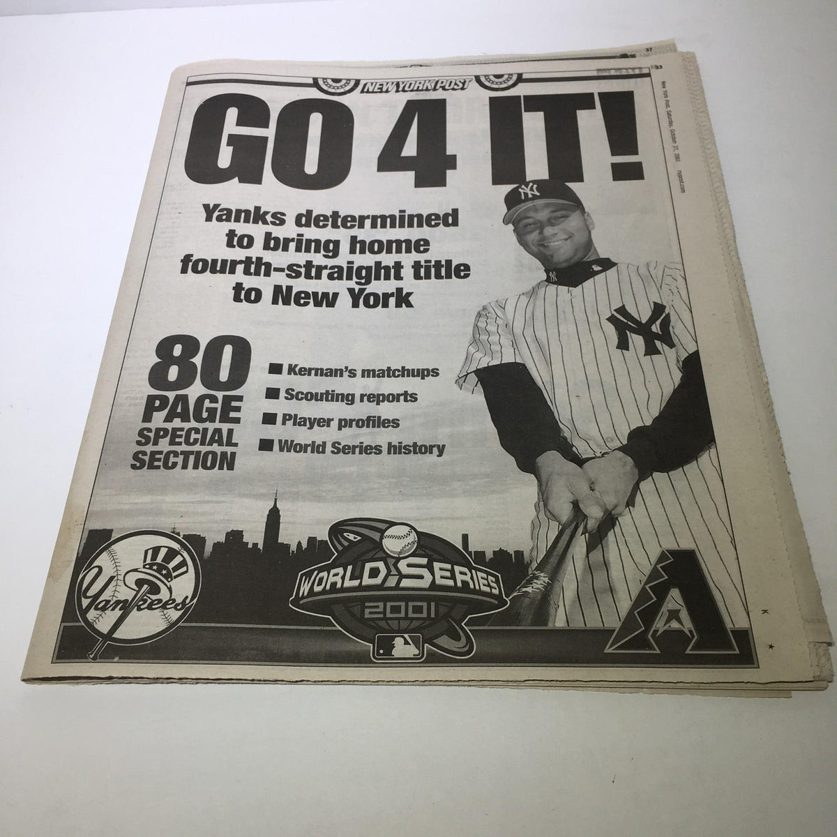 Image of the NY Post front page from October 27, 2001, featuring the title 'GO 4 IT! Yanks determined to bring home fourth-straight title to New York' with a player in a Yankees uniform.
