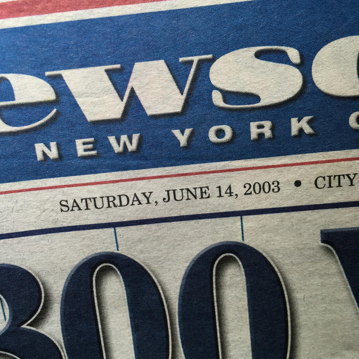 Newsday front page dated June 14, 2003, featuring the headline 'On 4th Try, Clements Gets Big Win & Strikeout Mark 2 Boot' with the date prominently displayed.