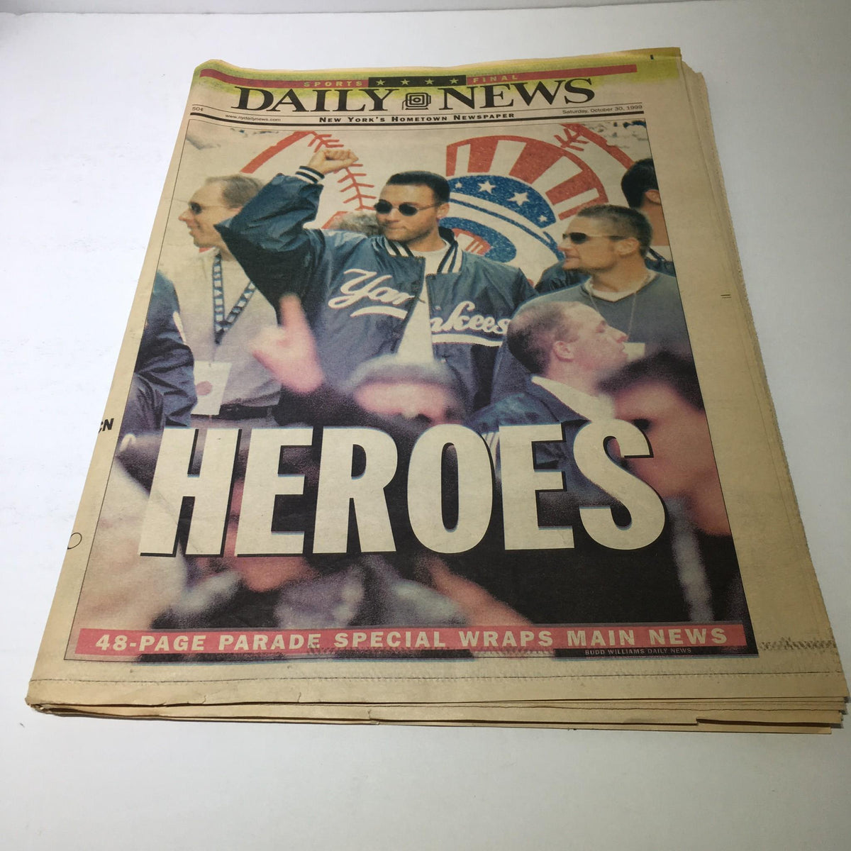 New York Daily News headline from October 30, 1999, featuring a heroes parade with Yankees players, captioned 'HEROES'.