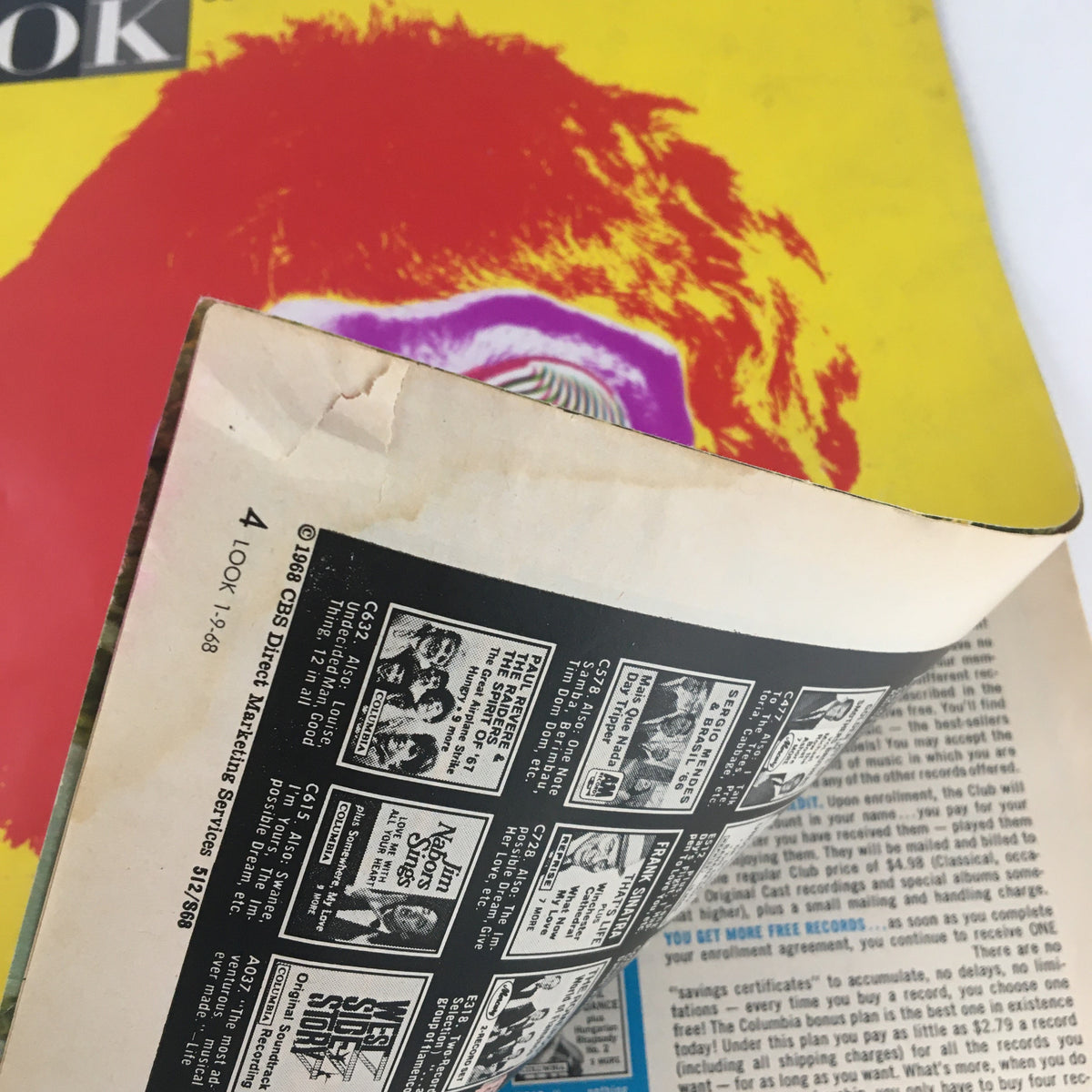 Inside view of Look Magazine January 9, 1968 with pages folded showing advertisements and details about the publication.