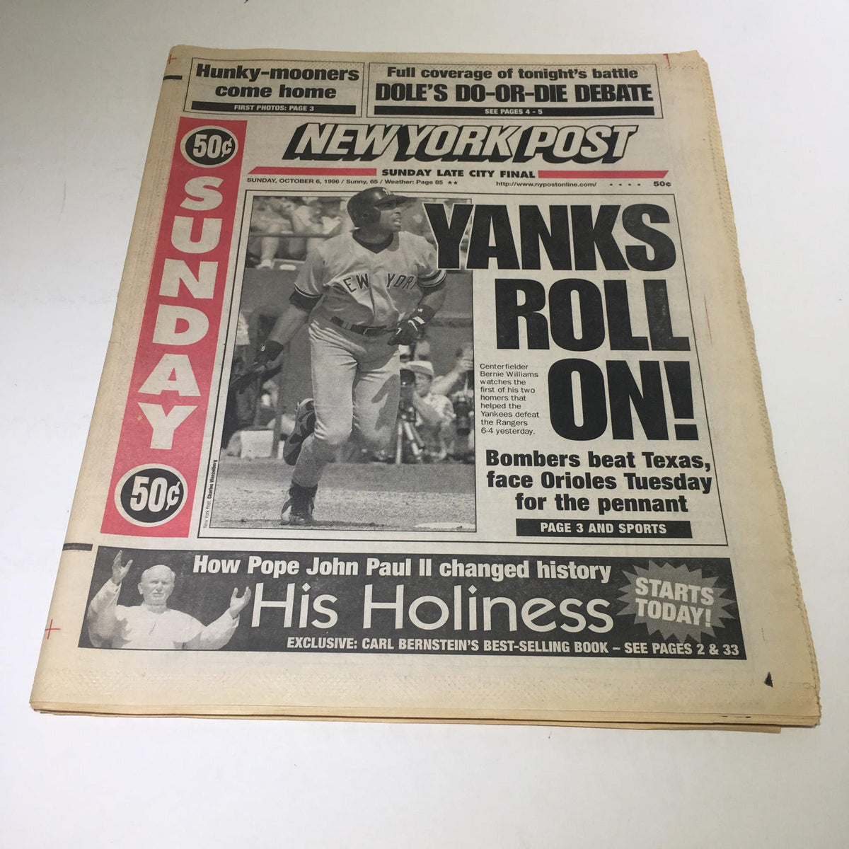 New York Post front page from October 6, 1996, featuring the headline 'Yanks Roll On!' showcasing a baseball player with a celebration scene in the background.