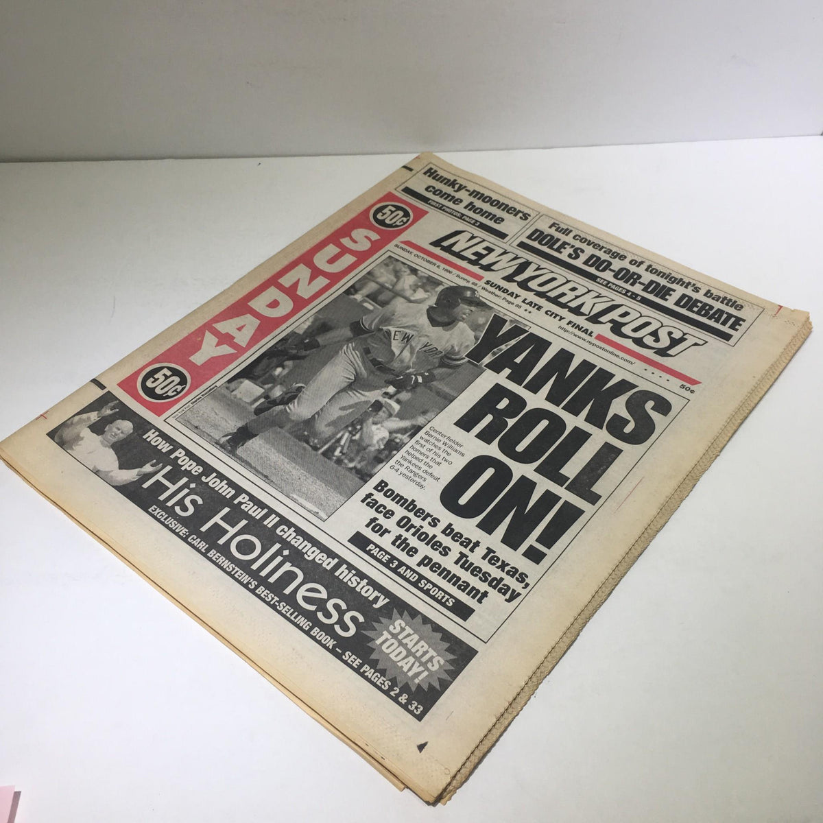 New York Post from October 6, 1996, featuring the headline 'Yanks Roll On!' showcasing a vintage newspaper layout with a sports theme.