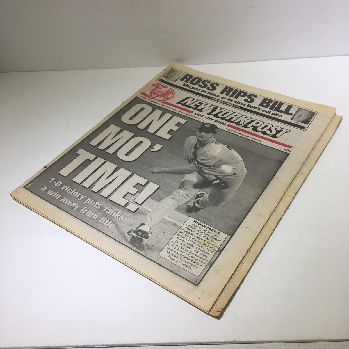New York Post: Oct 25 1996 One Mo' Time magazine front cover featuring a baseball player in motion, celebrating a 1-0 victory that brings the Yankees a win away from the championship title. This vintage magazine captures an important moment in sports history during the late 1990s.
