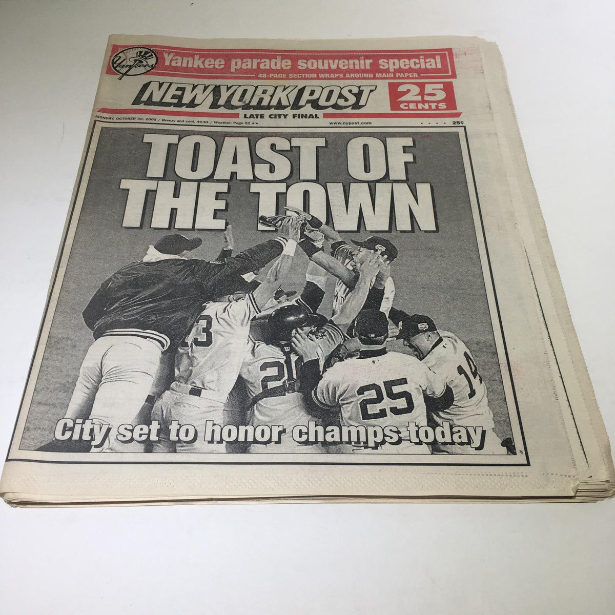 New York Post newspaper cover from October 30, 2000, featuring the headline 'Toast of the Town' celebrating a championship victory, with a group of players raising their hands in triumph.