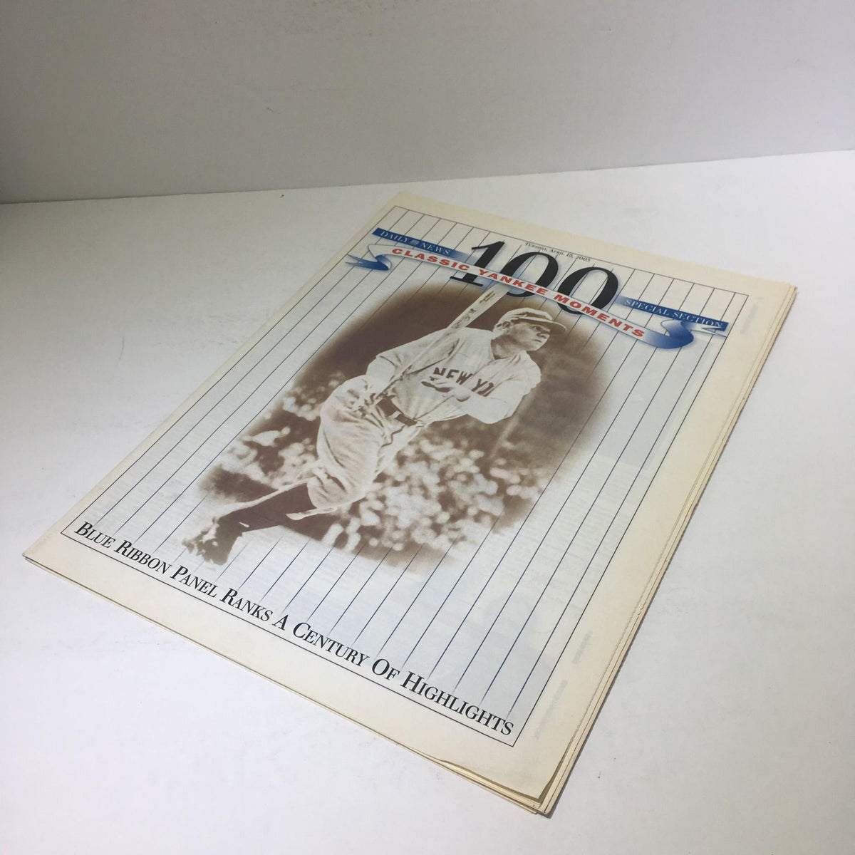 Front of the New York Daily News: April 15 2003 Blue Panel Ranks A Century Of Highlights magazine, featuring a vintage Yankee player.
