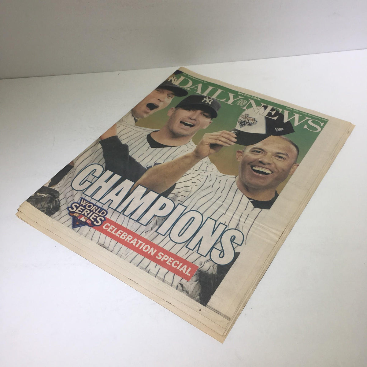 Cover of NY Daily News: Nov 6 2009 Parade of Champions World Series Celebration Special featuring baseball players celebrating with smiles and a championship trophy.