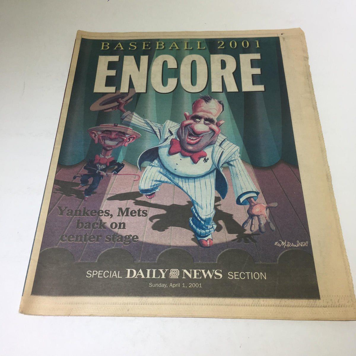 New York Daily News cover from April 1, 2001, featuring the title 'Encore' with a themed illustration depicting Yankees and Mets players on center stage.