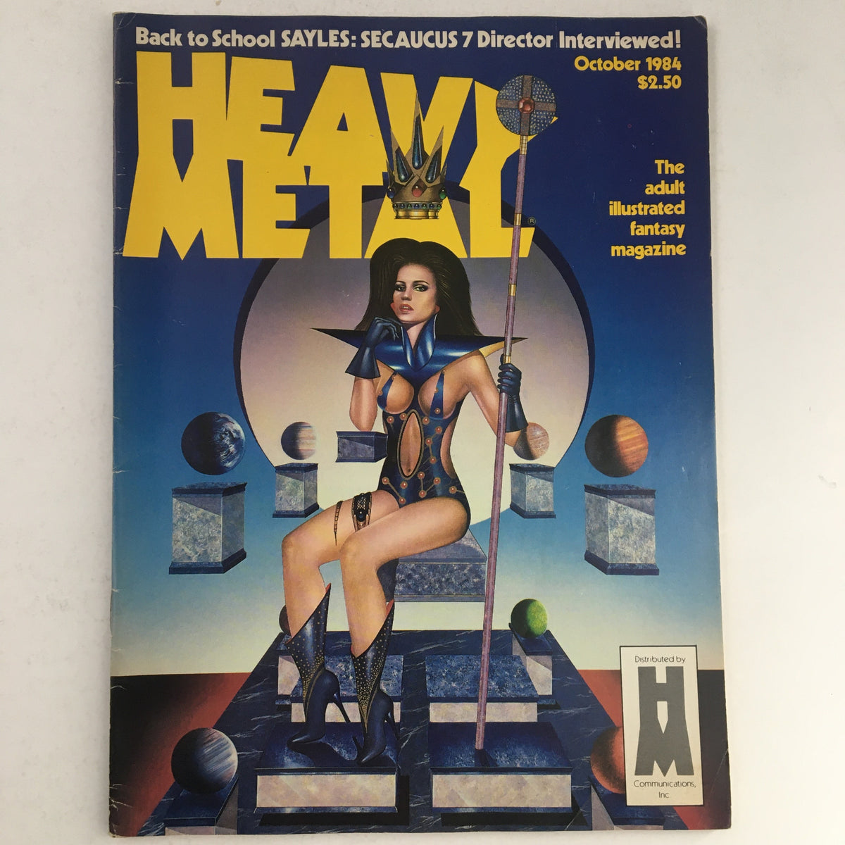 Cover of Heavy Metal Fantasy Magazine October 1984 featuring a stunning illustration of a female figure in a futuristic setting by artist Juan G. The magazine highlights its adult illustrated fantasy theme.
