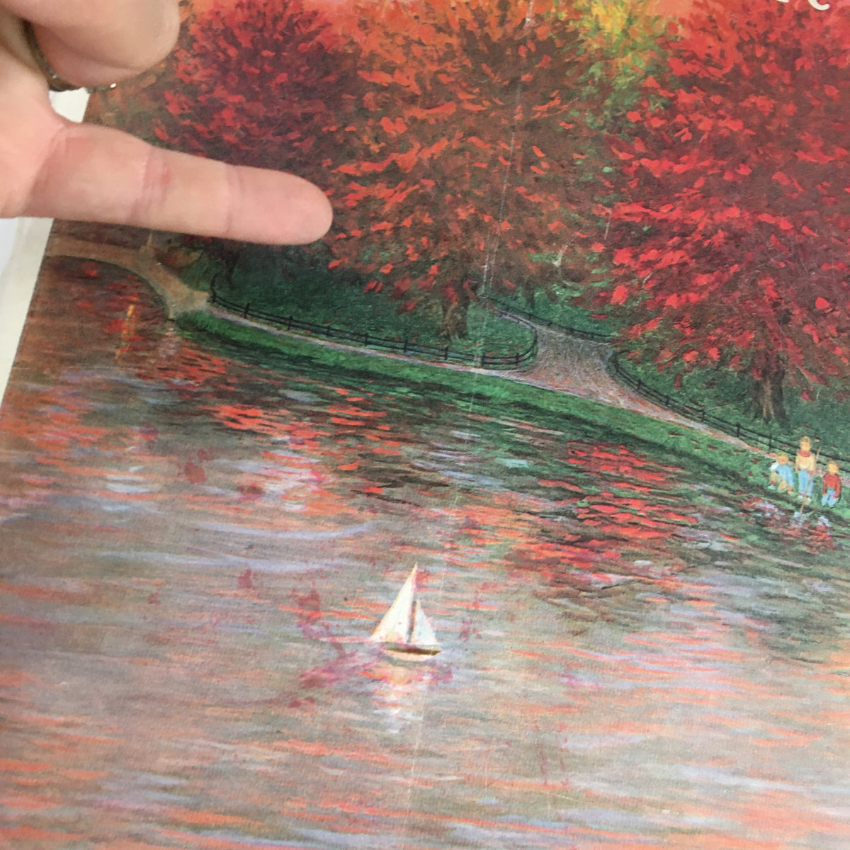 Close-up view of The New Yorker Magazine October 20 1956 cover, highlighting the autumn trees and sailboat, showcasing the artwork by Edna Eicke.