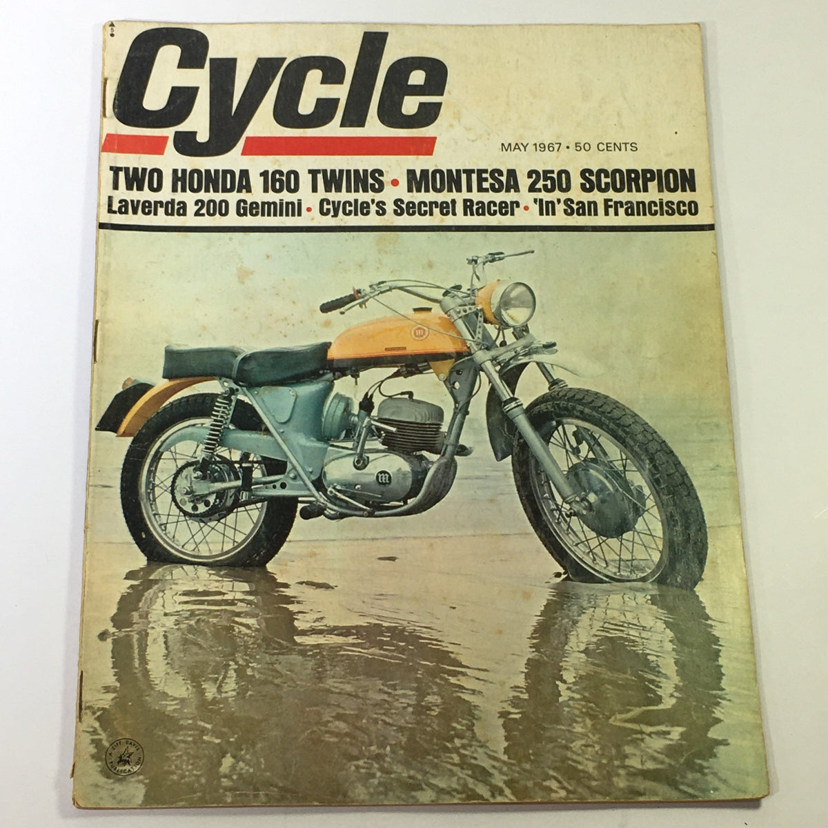 Cover of VTG Cycle Magazine May 1967 featuring two Honda 160 Twins, Montesa 250 Scorpion, and Laverda 200 Gemini showcased on a wet surface.