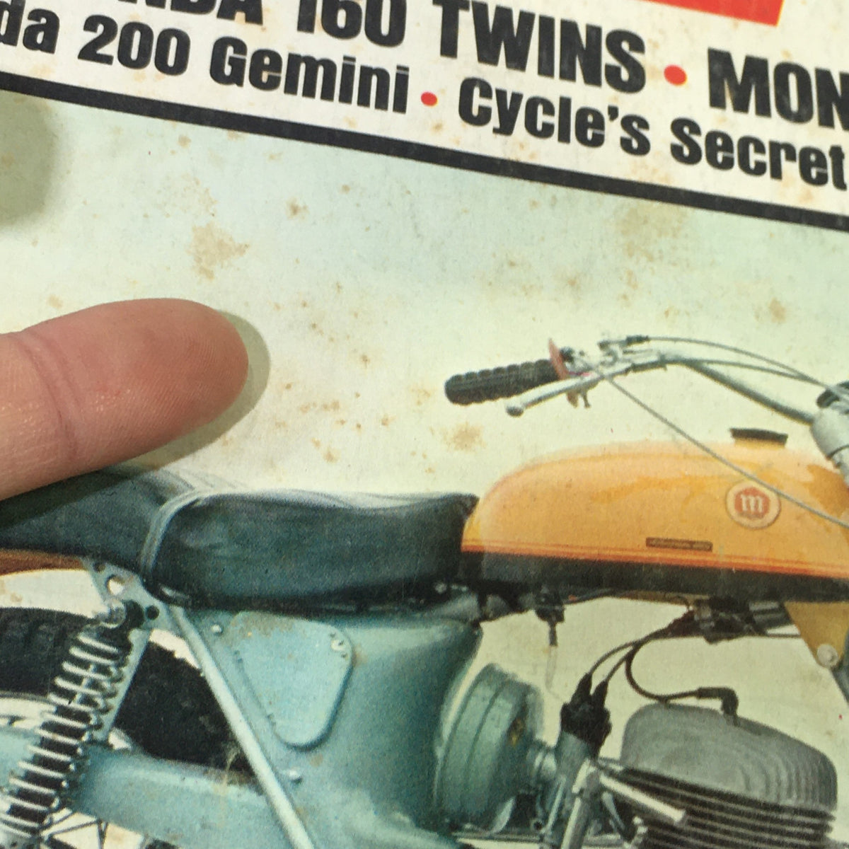 Zoomed-in view of VTG Cycle Magazine May 1967 showing details on the cover regarding Honda 160 Twins and Montesa 250 Scorpion.