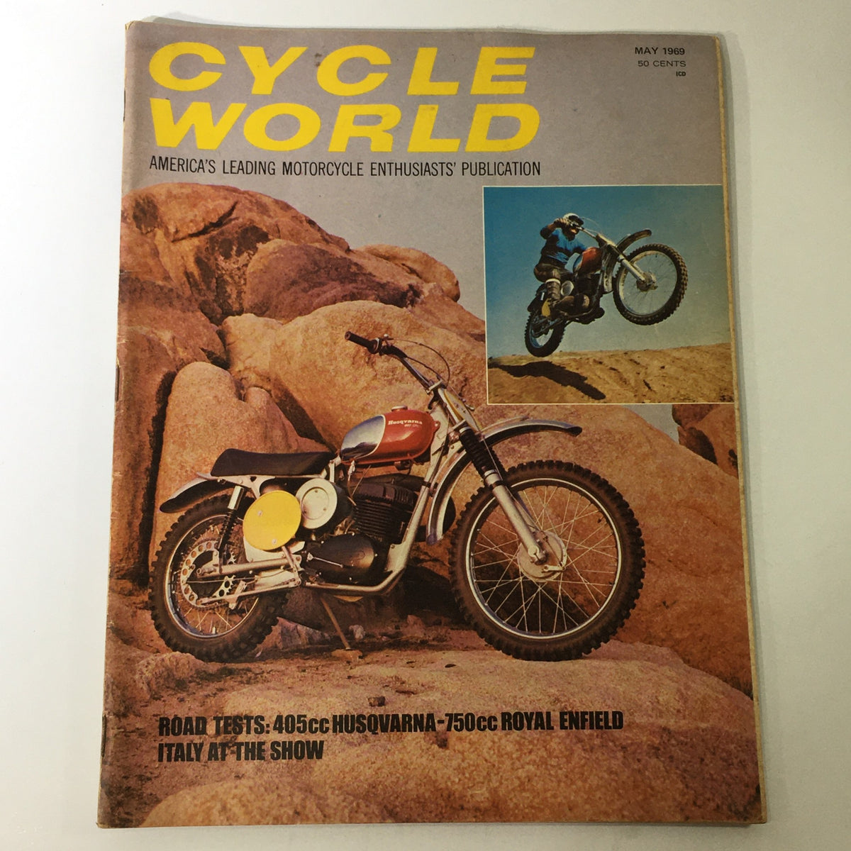 Cover of Cycle World magazine from May 1969 featuring a 405cc Husqvarna and 750cc Royal Enfield with off-road motorcycle imagery. The magazine highlights road tests and motorcycle culture of the era.