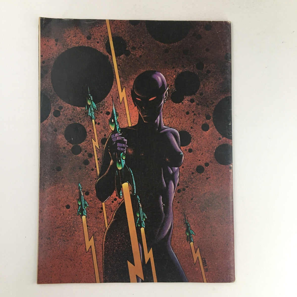 Back cover of Heavy Metal Magazine July 1979 with striking artwork, illustrating a figure amid space-themed elements, aligning with the magazine's unique style.