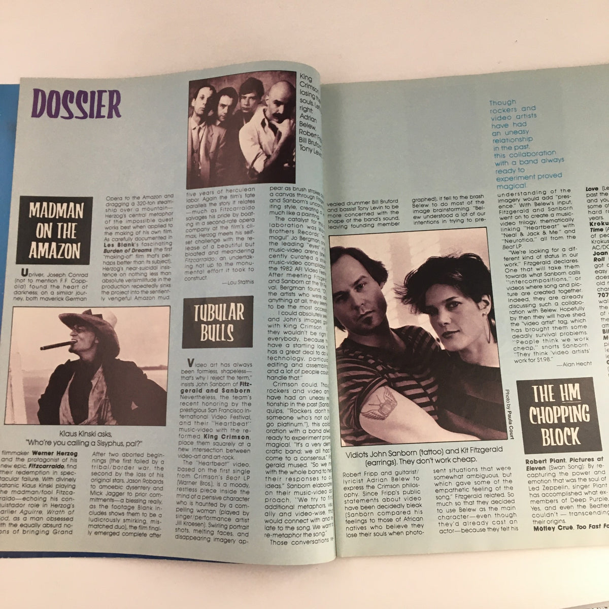 Inside spread of Heavy Metal Magazine December 1982 titled 'Dossier' featuring articles about various music and film personalities.