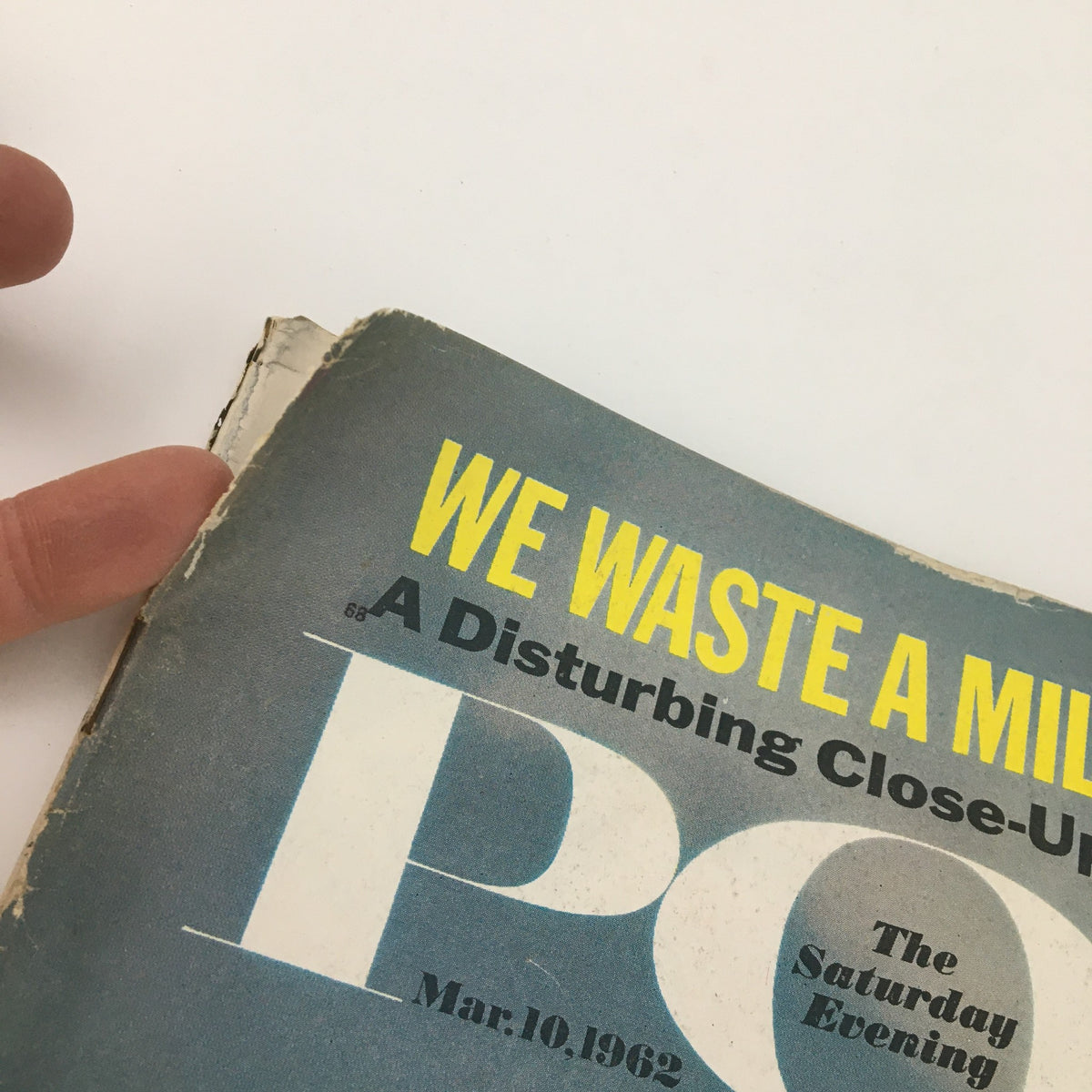 Close-up image of the cover of The Saturday Evening Post from March 10, 1962, featuring the title 'WE WASTE A MILLION' and the subtitle 'A Disturbing Close-Up,' highlighting the magazine's critical look at American society during that era.