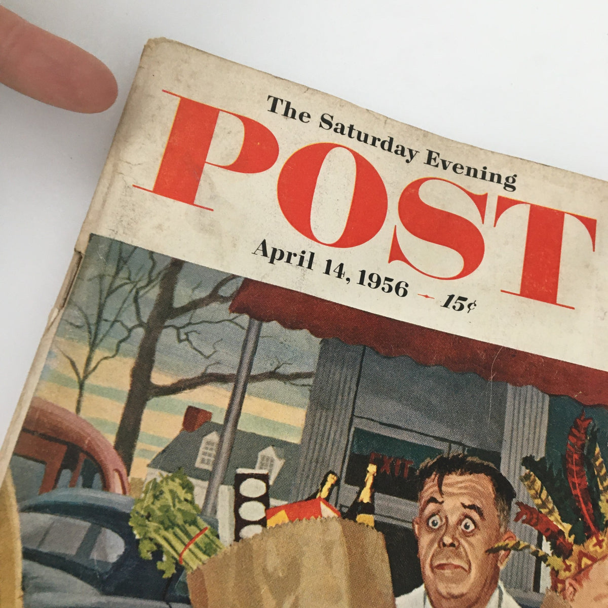 Cover of The Saturday Evening Post dated April 14, 1956, featuring vibrant artwork depicting a grocery scene, reflecting mid-20th century American life as part of the issue including 'My Life in Bellevue' by Dr. Salvatore C.