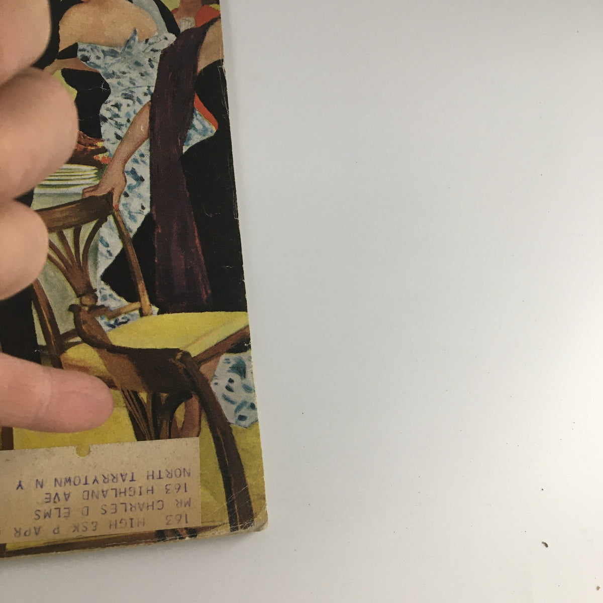 Back cover view of The Saturday Evening Post from November 11, 1961, showcasing a portion of the magazine's edge and an address label, adding character to this vintage publication.