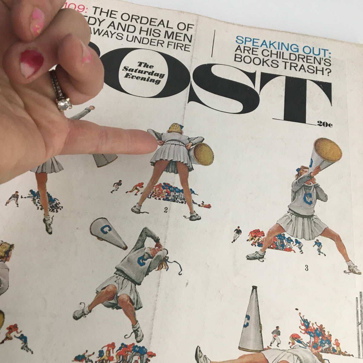 Close-up of The Saturday Evening Post cover from November 25, 1961, highlighting cheerleaders and the article 'The Ordeal of John F. Kennedy'.