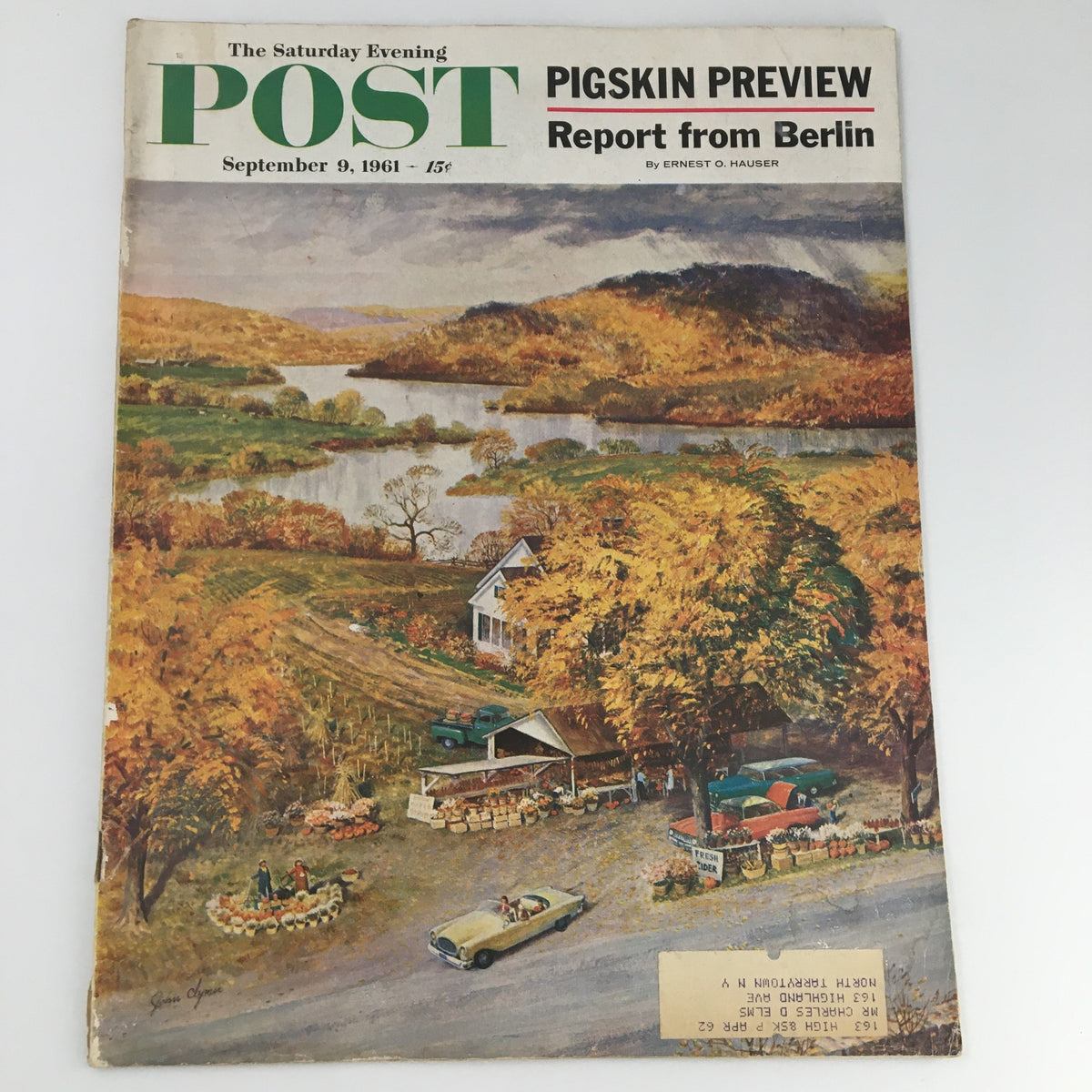 Cover of The Saturday Evening Post from September 9, 1961, featuring the article 'Report From Berlin' by Ernest Hauser, showcasing a scenic autumn landscape with a farm stand and a classic car.