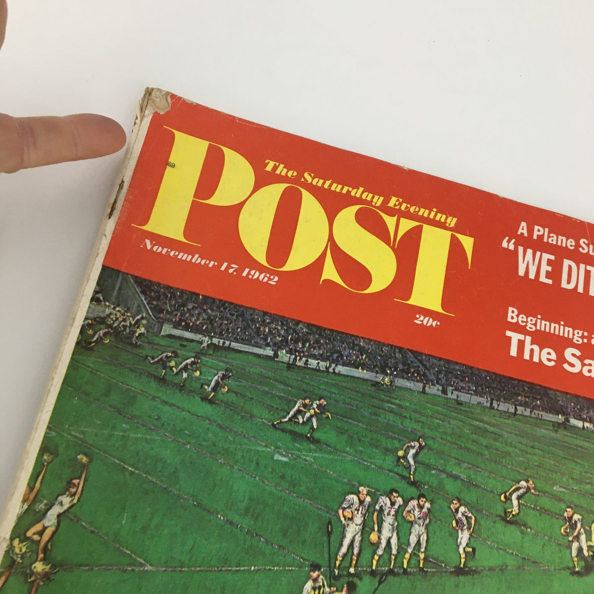 Close-up view of the cover of The Saturday Evening Post from November 17, 1962, highlighting 'The Sand Pebbles' novel alongside a football scene and key headlines.