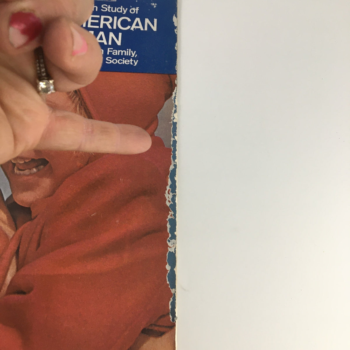 Side view of The Saturday Evening Post from December 22-29, 1962, highlighting the wear on the magazine's spine and detailing the story about The American Woman's roles in society.