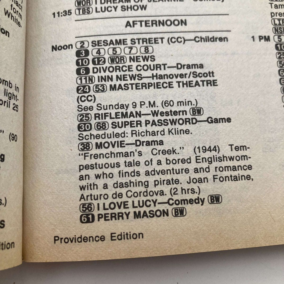 Interior page of TV Guide Magazine May 4, 1985, listing TV shows including 'Sesame Street' and 'I Love Lucy.' Part of the Providence Edition, highlighting the programming of the era.
