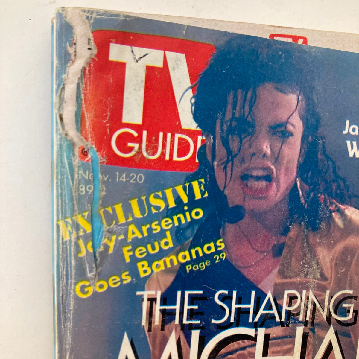 Close-up of the cover of TV Guide Magazine from November 14, 1992, showcasing Michael Jackson's intense expression with the title 'The Shaping of Michael Jackson.' The magazine also features a promotional banner about an exclusive article on the Jay-Arsenio feud.