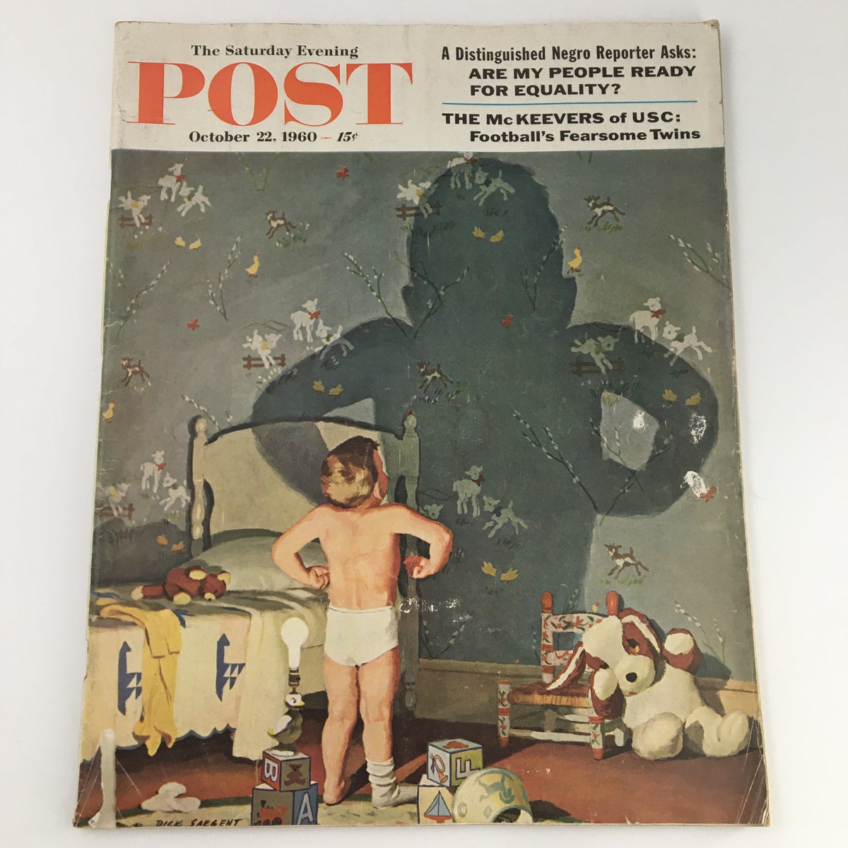 Cover of The Saturday Evening Post from October 22, 1960, featuring the captivating story of 'The McKeevers of USC' with an image of a young boy in a room surrounded by toys and a large shadow on the wall.