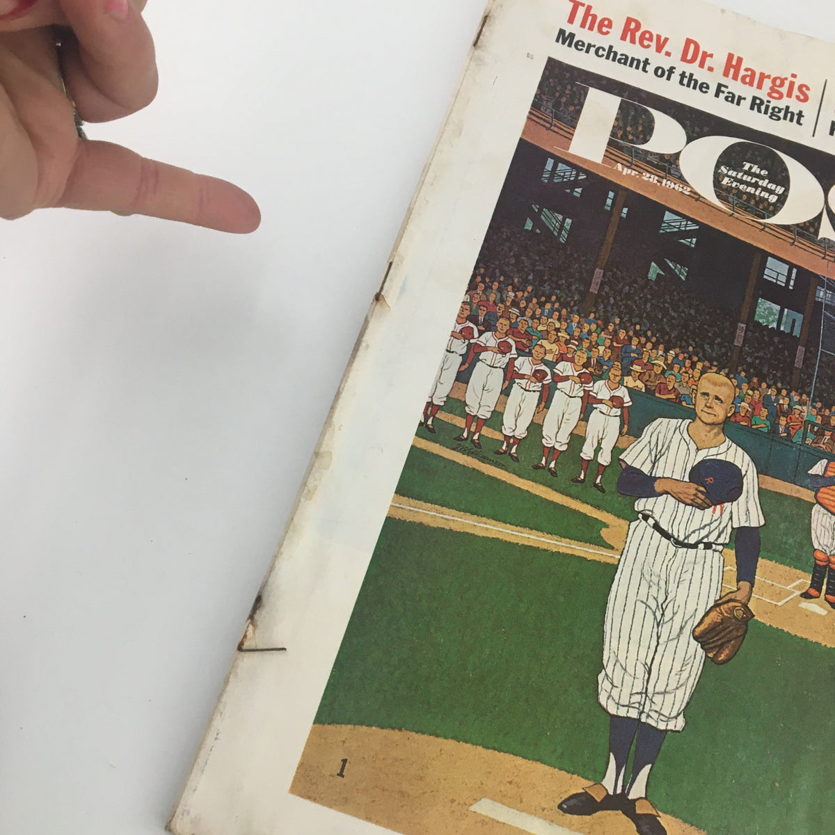 Close-up view of The Saturday Evening Post cover from April 28, 1962, depicting Pittsburgh's Mighty Dick Stuart standing on a baseball diamond, highlighting the vintage magazine's art and the audience behind.