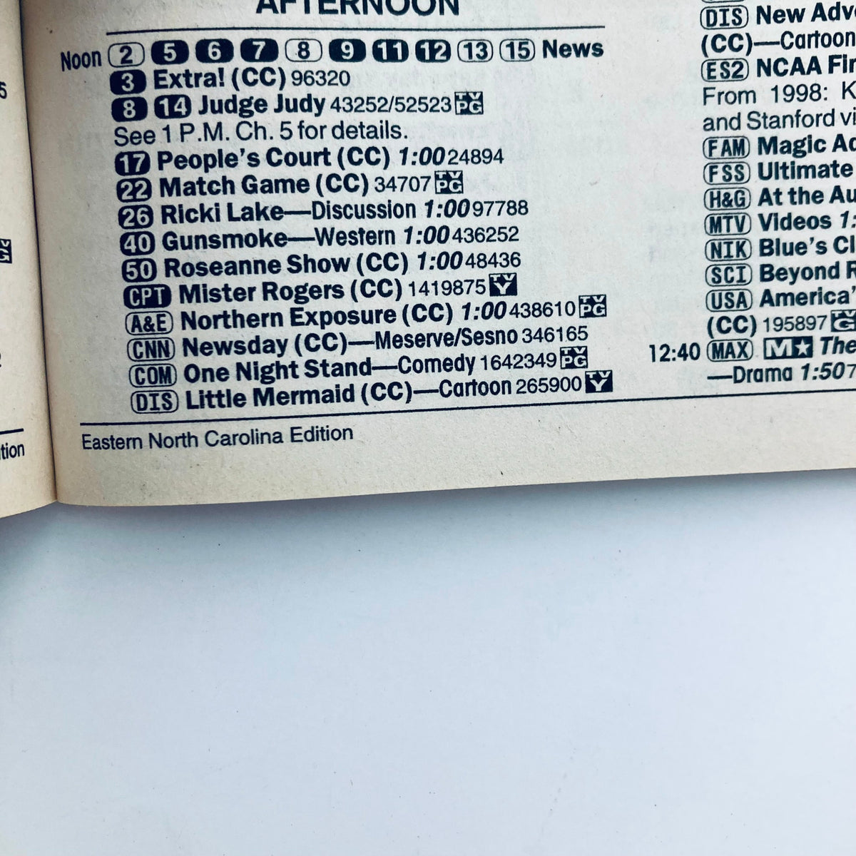 Inside page of TV Guide Magazine March 27 1999 showcasing TV show listings for the afternoon, including popular programs such as Judge Judy and Roseanne Show.